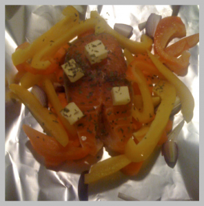 The salmon steak, basil and peppers before cooking.