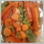 Salmon hidden under peppers, carrots and very visible celery.